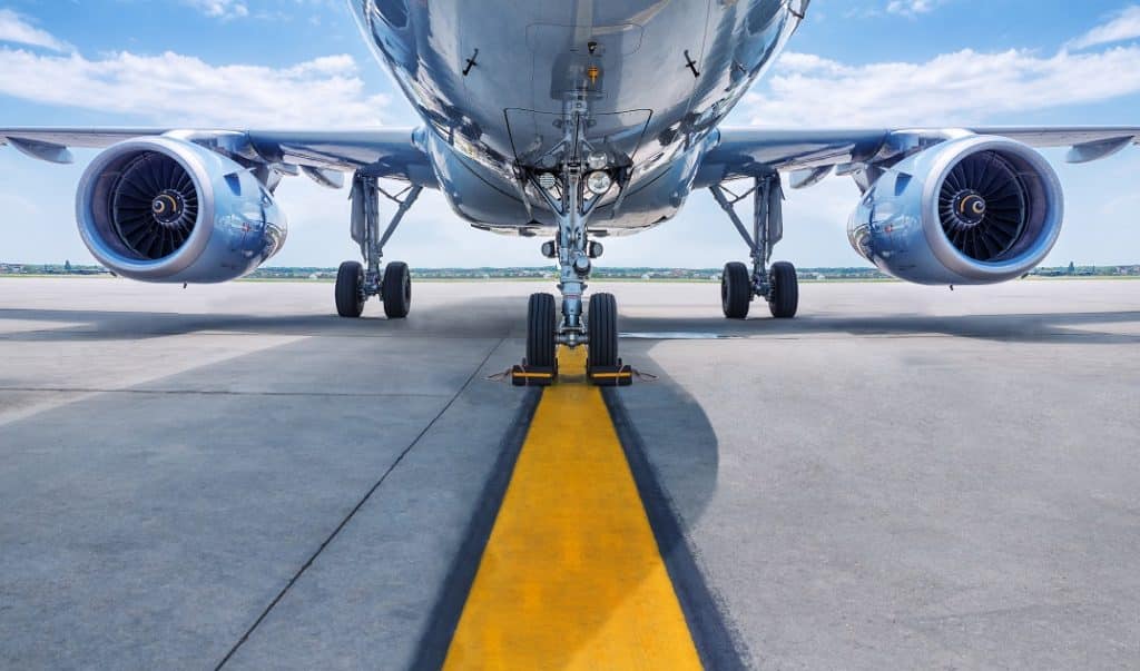Parked Airplane on Yellow Line